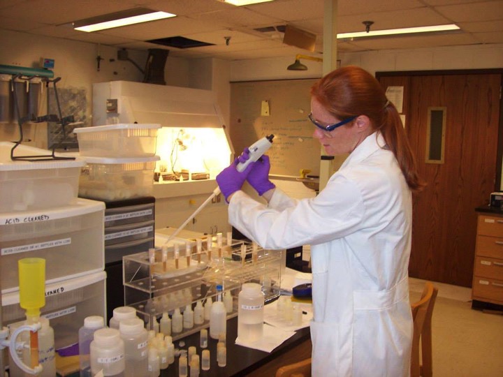Wendy Bohon working with samples in a laboratory.