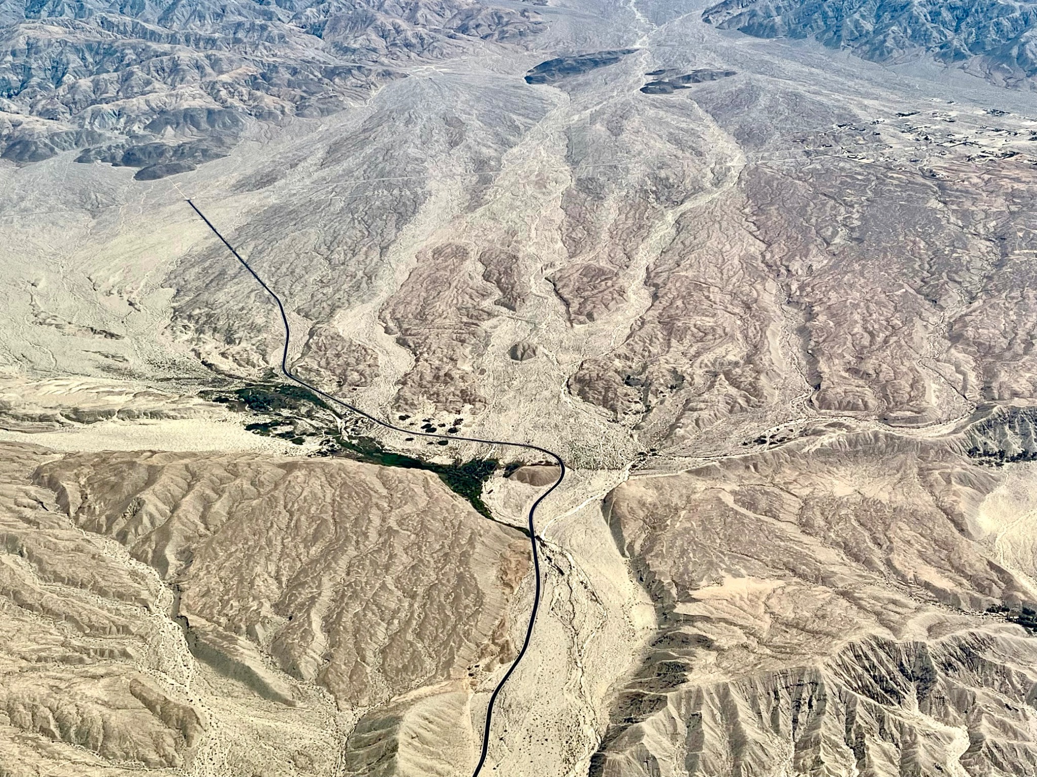 A vegetated fault crossing the landscape.